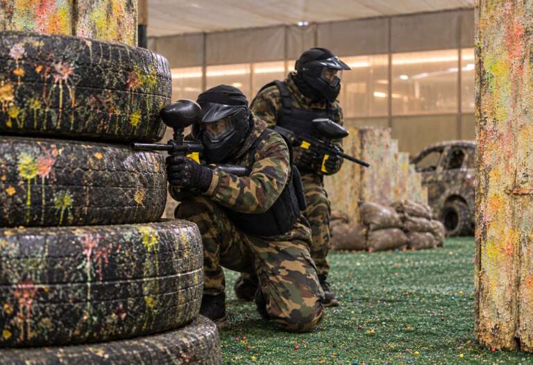 Colleagues in camo laughing before a match