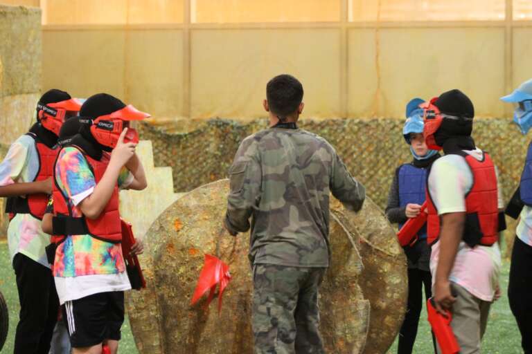 Birthday squad in masks getting ready with a marshal
