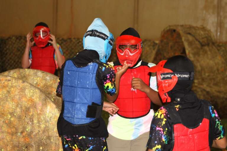Birthday guests putting on their masks