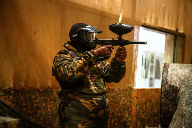 Corporate player shooting in full camo gear