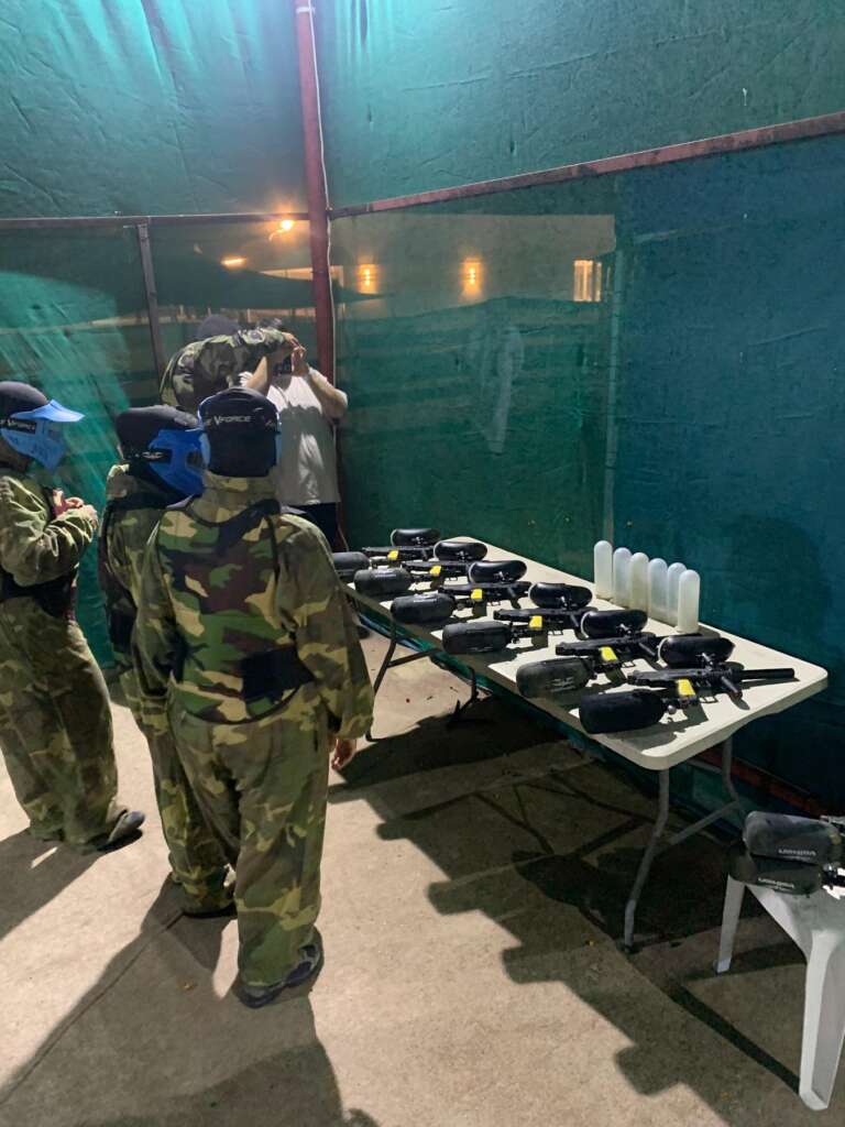 Masked players gearing up at an outdoor event