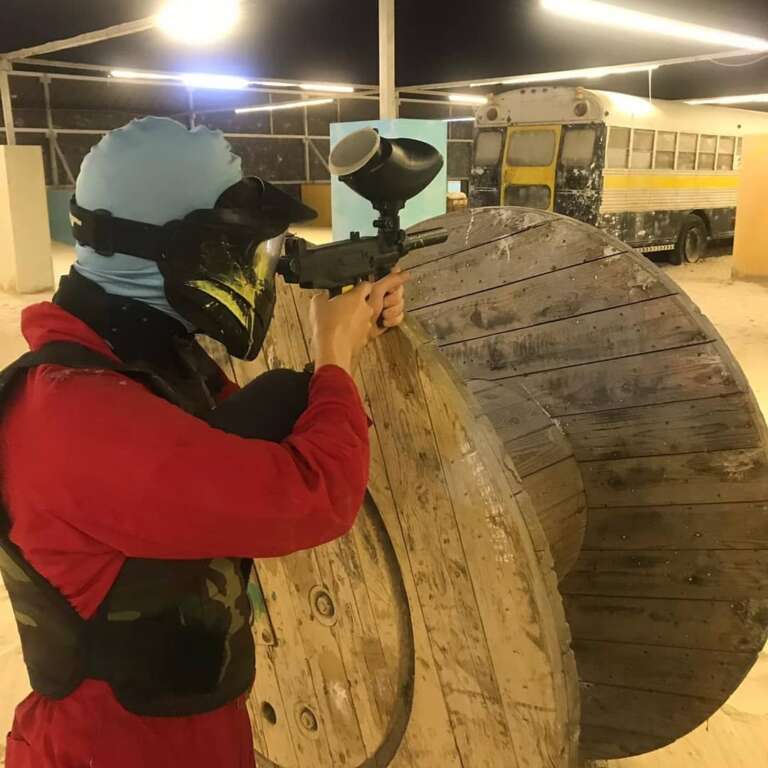 Masked player aiming at an outdoor event