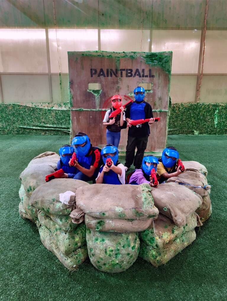 Students in masks on the sandbag bunker
