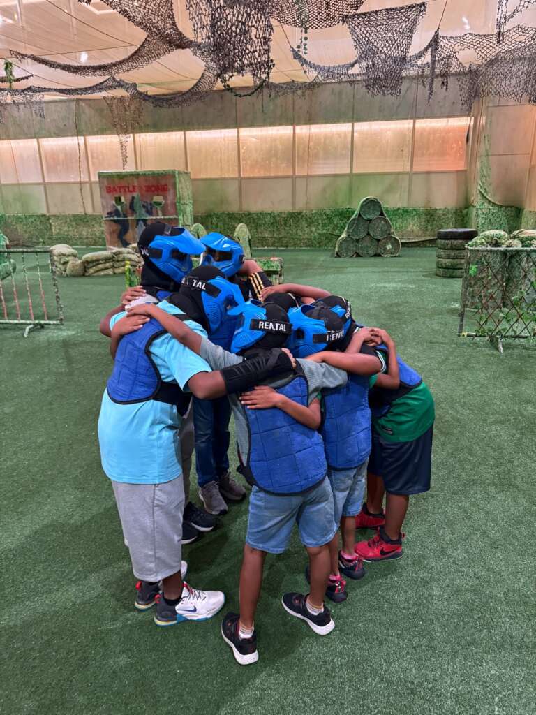Students in a team huddle before the game