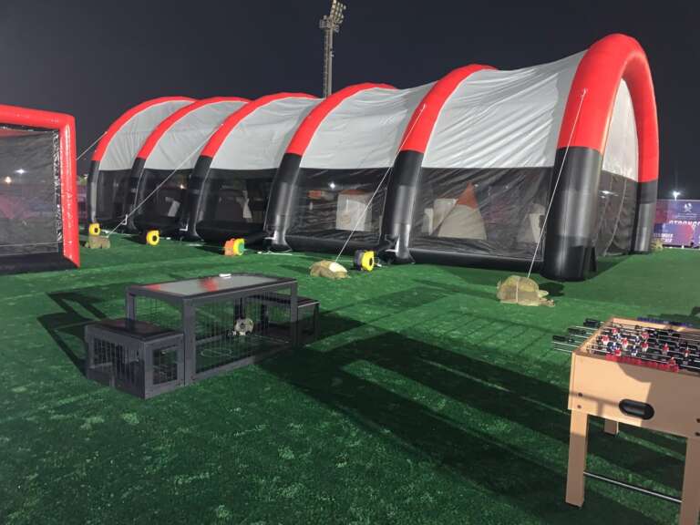 Battle Zone full inflatable arena setup at an outdoor event