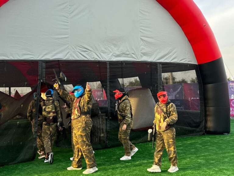 Masked teams at the Qatar National Sports Day arena